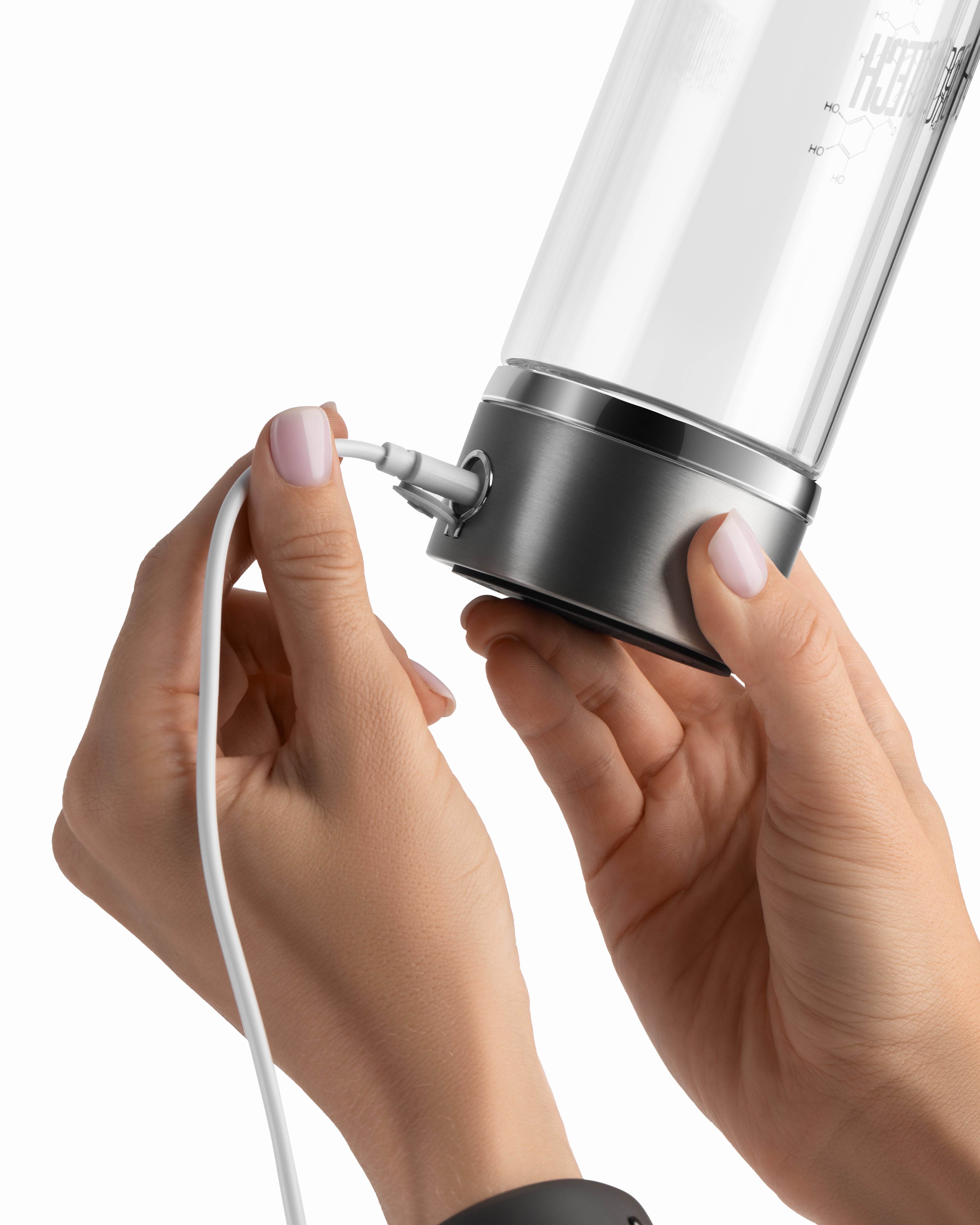 Charging the Hydrotech hydrogen water bottle with USB-C cable close-up